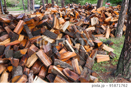 Large pile of firewood ready to be burnt 95871762