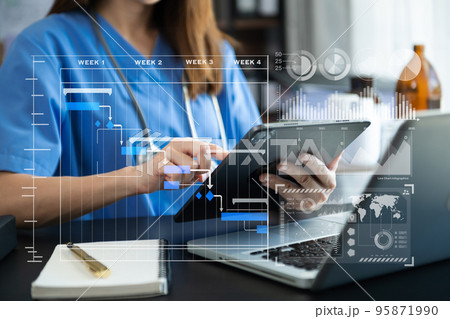 Project manager working and update tasks with Gantt chart scheduling diagram at hospital .success smart medical doctor working with smart medical doctor concept.. Project manager working and update tasks with Gantt chart scheduling diagram at hospital .success smart medical doctor working with smart medical doctor concept.. 95871990
