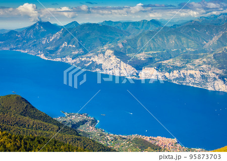 Above idyllic and turquoise Lake Garda from Monte Baldo, Malcesine, Italy Above idyllic and turquoise Lake Garda from Monte Baldo, Malcesine, Italy 95873703