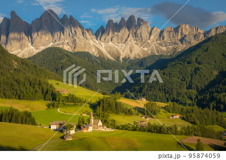 St. Magdalena with famous church in Val di Funes at sunset, Dolomites , Italy 95874059