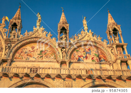 St Mark Basilica facade detail, with lion and angels, Venice, Italy 95874305