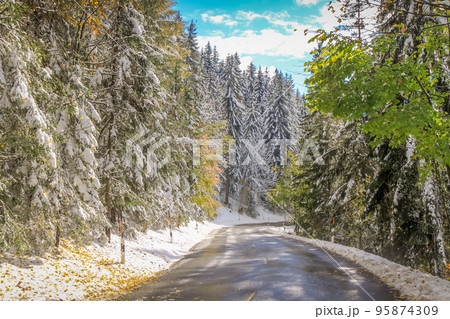 Mountain Road between Bavarian Alps and Austrian Tyrol at autumn, after snow 95874309