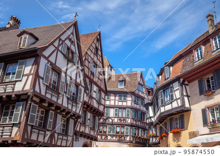 Colmar alsatian architecture at springtime with flowers, Eastern France 95874550