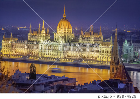 Parliament illuminated and Danube River at dramatic evening, Budapest, Hungary 95874829