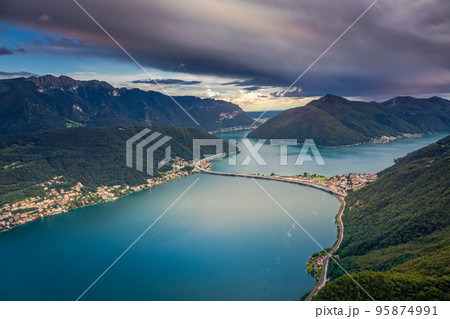 Dramatic sunset over Lake Lugano in swiss Alps, Switzerland 95874991