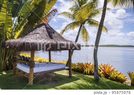Porto Seguro Beach with tropical tregarden e and gazebo palapa in BAHIA, Brazil Porto Seguro Beach with tropical tregarden e and gazebo palapa in BAHIA, Brazil 95875078