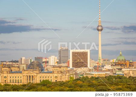 Berlin cityscape skyline over Tiergarten at peaceful sunset, Germany Berlin cityscape skyline over Tiergarten at peaceful sunset, Germany 95875369