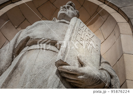 Worker with Marx, Engels and Lenin book in Warsaw, Poland 95876224