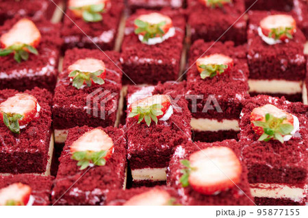 Beautiful delicious juicy cakes with red sponge cake and strawberries 95877155