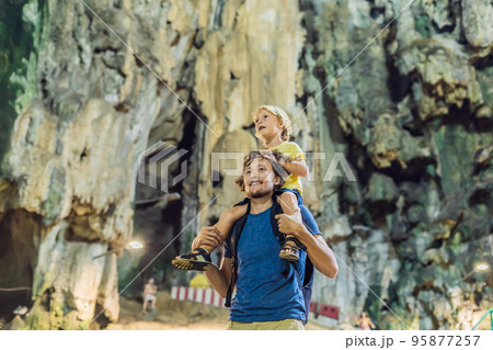 Father and son in the background of Batu Caves, near Kuala Lumpur, Malaysia. Traveling with children concept 95877257