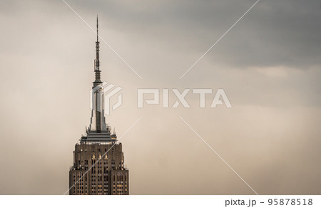Vintage view of a skyscraper tower in a light haze of fog or smog 95878518