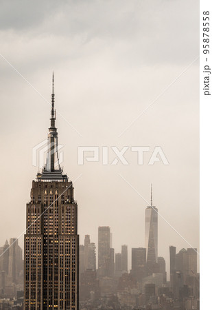 Futuristic view of a skyscraper tower in a light haze of fog or smog 95878558