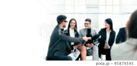 blurry image business colleagues greet each other in the conference room. 95879595