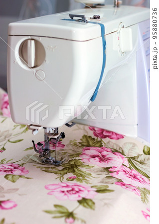 Modern sewing machine and item of clothing Modern sewing machine and item of clothing 95880736