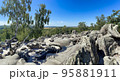 sandstone rocks with a view with trees and blue sky 95881911