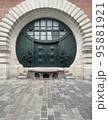 round door from the Middle Ages in a wall 95881921