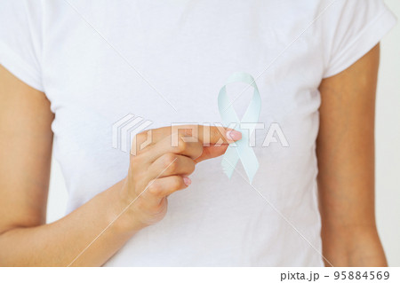 Brain Cancer Awareness month, woman hand holding white color Ribbon Brain Cancer Awareness month, woman hand holding white color Ribbon 95884569