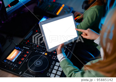 Closeup digital tablet over sound mixer 95885142
