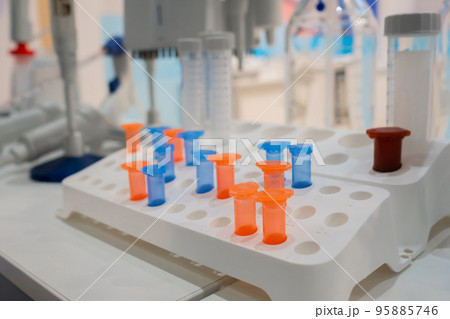 Medical plastic vials in showcase at pharmaceutical exhibition 95885746