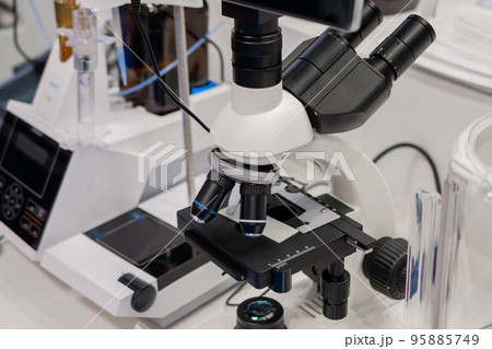 Close up view of laboratory equipment, optical microscope Close up view of laboratory equipment, optical microscope 95885749