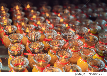 Candles in the Buddhist temple of Kek Lok Si in Malaysia Candles in the Buddhist temple of Kek Lok Si in Malaysia 95885772