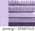 Pile of wool sweaters in trendy colour of the year 2023 digital lavende 95887310