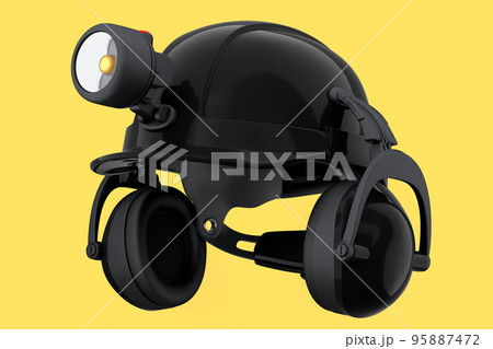 Black safety helmet or hard cap with flashlight and headphones on yellow Black safety helmet or hard cap with flashlight and headphones on yellow 95887472