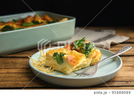 Tasty broccoli casserole served on wooden table Tasty broccoli casserole served on wooden table 95888089