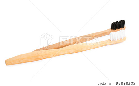 Natural bamboo toothbrushes with soft bristles isolated on white 95888305