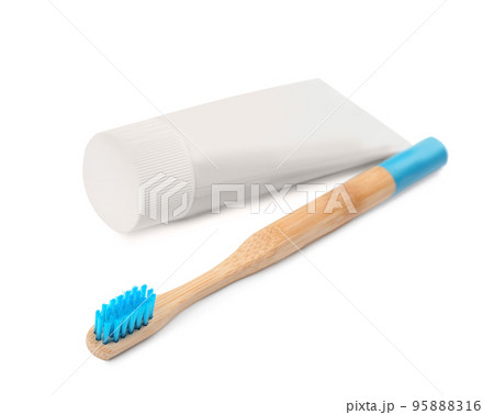 Bamboo toothbrush and paste isolated on white Bamboo toothbrush and paste isolated on white 95888316