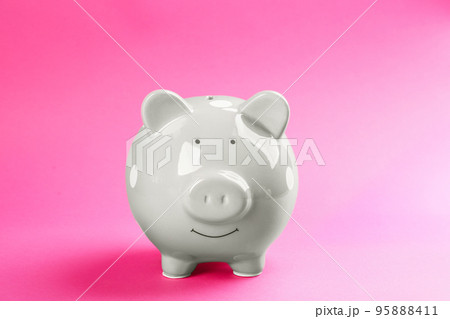 Cute grey piggy bank on pink background 95888411