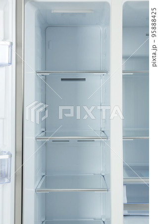 Shelves of empty modern refrigerator, closeup view Shelves of empty modern refrigerator, closeup view 95888425