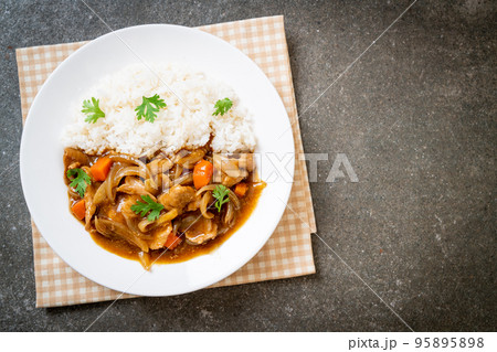 Japanese curry rice with sliced pork, carrot and onions 95895898