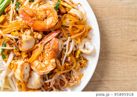 Pad Thai Seafood - Stir fried noodles with shrimps, squid or octopus and tofu Pad Thai Seafood - Stir fried noodles with shrimps, squid or octopus and tofu 95895918