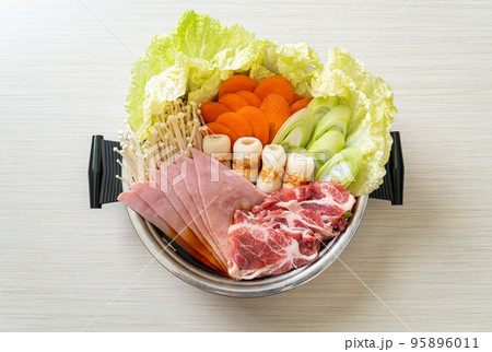sukiyaki or shabu hot pot black soup with meat raw and vegetable sukiyaki or shabu hot pot black soup with meat raw and vegetable 95896011