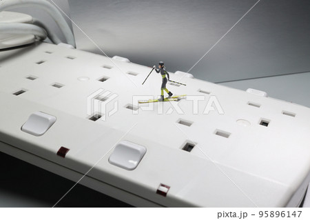 a mini skier on socket, winter sports. a mini skier on socket, winter sports. 95896147