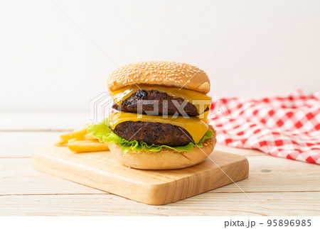 hamburger or beef burgers with cheese and french fries hamburger or beef burgers with cheese and french fries 95896985