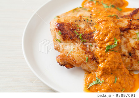 grilled chicken steak with red curry sauce grilled chicken steak with red curry sauce 95897091