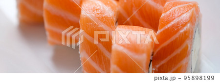 Delicious philadelphia masago rolls on white plate Delicious philadelphia masago rolls on white plate 95898199