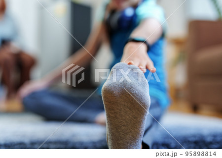 stress relief, muscle relaxation, breathing exercises, exercise, meditation, portrait of Young Asian woman relaxing her body from office work by practicing yoga by watching online tutorials 95898814