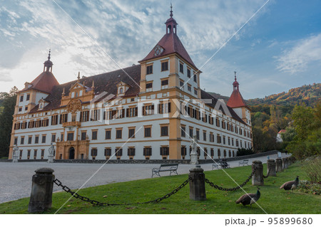 Colorful autumn colors, bright blue sky in the park and Eggenberg Palace in Graz, Styria region, Austria Colorful autumn colors, bright blue sky in the park and Eggenberg Palace in Graz, Styria region, Austria 95899680