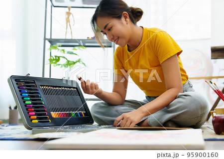 Portrait of an Asian woman designing art in her spare time 95900160