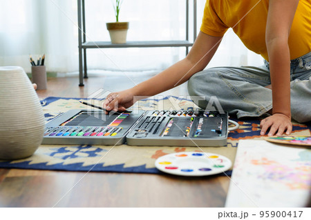 Portrait of an Asian woman designing art in her spare time Portrait of an Asian woman designing art in her spare time 95900417
