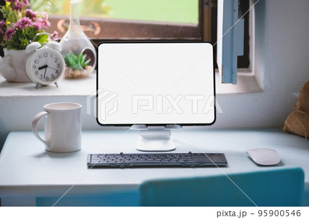 tablet for work on wood desk, a blank tablet screen can add text or other media tablet for work on wood desk, a blank tablet screen can add text or other media 95900546