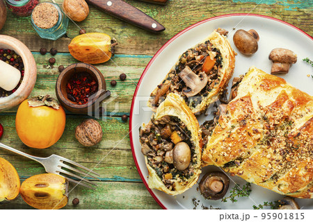 Tasty autumn pie with mushrooms champignons. 95901815