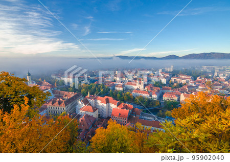 Cityscape of Graz with Mur river and Mariahilfer church (Mariahilferkirche), view from the Shlossberg hill, in Graz, Styria region, Austria Cityscape of Graz with Mur river and Mariahilfer church (Mariahilferkirche), view from the Shlossberg hill, in Graz, Styria region, Austria 95902040