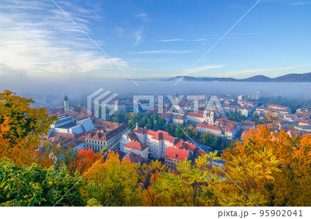 Cityscape of Graz with Mur river and Mariahilfer church (Mariahilferkirche), view from the Shlossberg hill, in Graz, Styria region, Austria Cityscape of Graz with Mur river and Mariahilfer church (Mariahilferkirche), view from the Shlossberg hill, in Graz, Styria region, Austria 95902041
