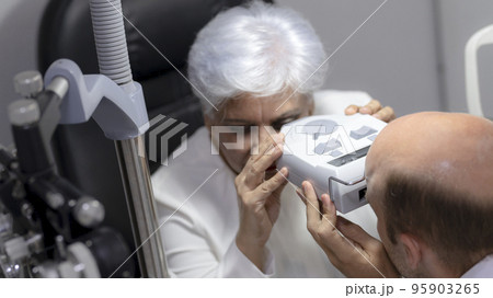 Elderly women have their eyes examined by an ophthalmologist. Elderly women have their eyes examined by an ophthalmologist. 95903265