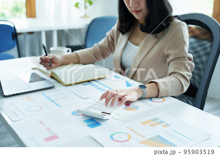 Accountants, Asian auditors are using calculators and computers to review annual tax budgets to submit information to the IRS 95903519