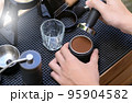 Barista making slow bar coffee. 95904582
